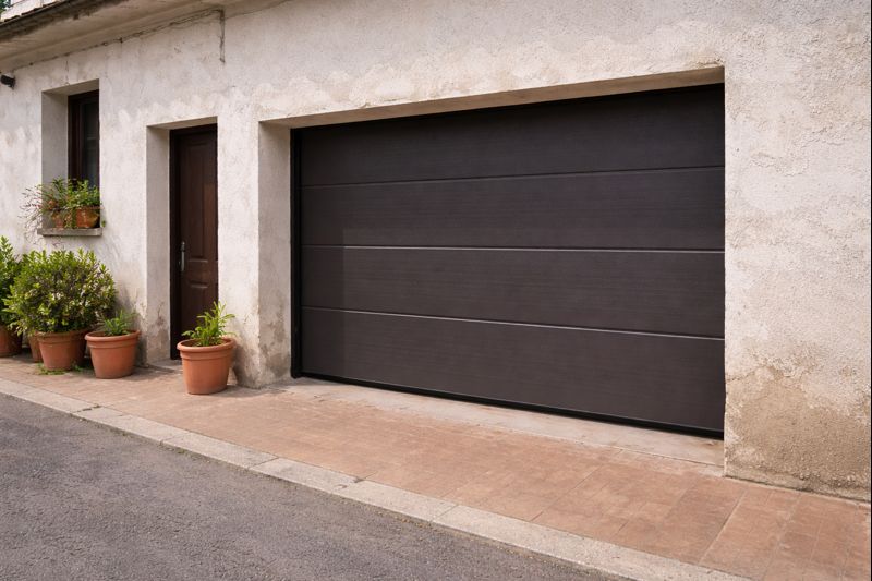 Reparación de puerta de garaje vivienda en Gandia